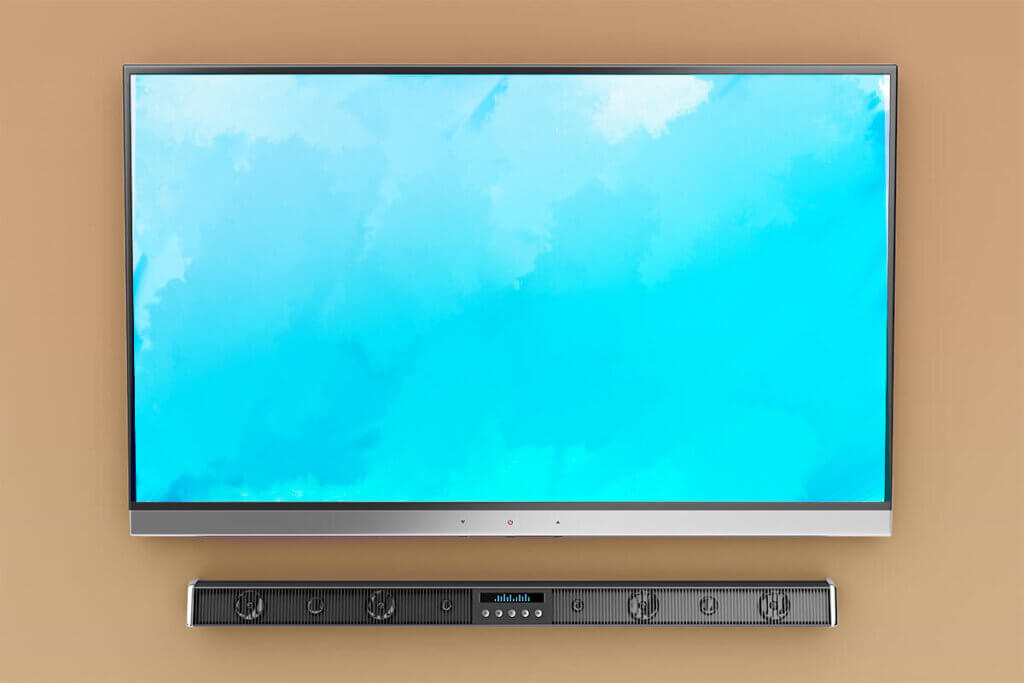 Fernseher mit Soundbar an Wand